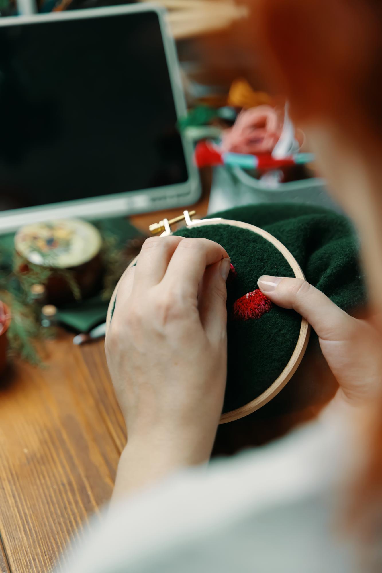 portrait of lead embroiderer at work